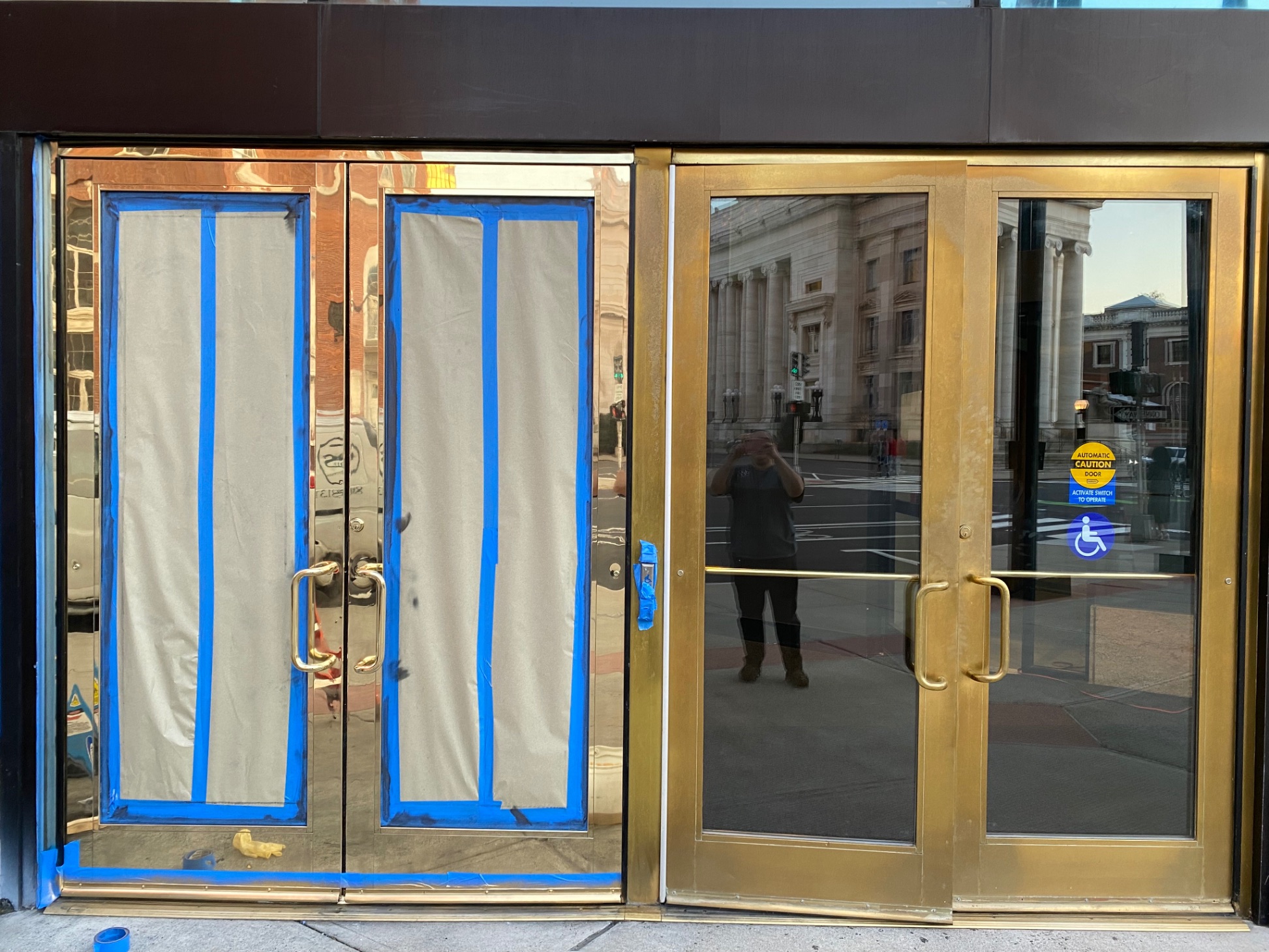 Commercial brass doors — during refinishing