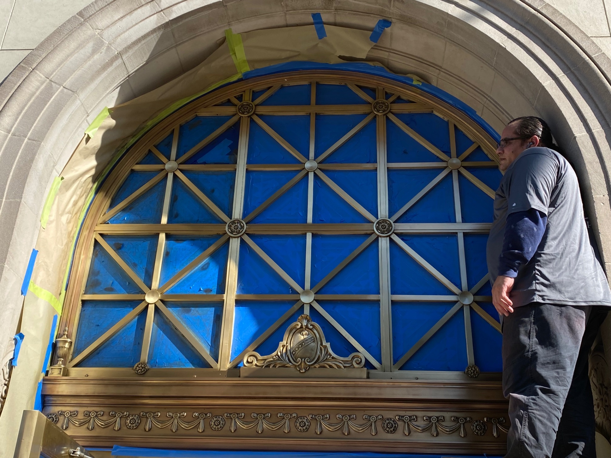 Brass entryway arch — during restoration